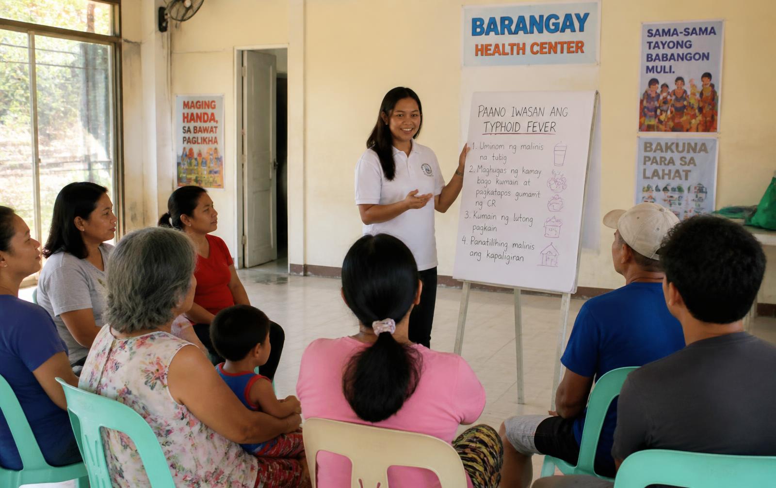 Community health education session in a barangay hall